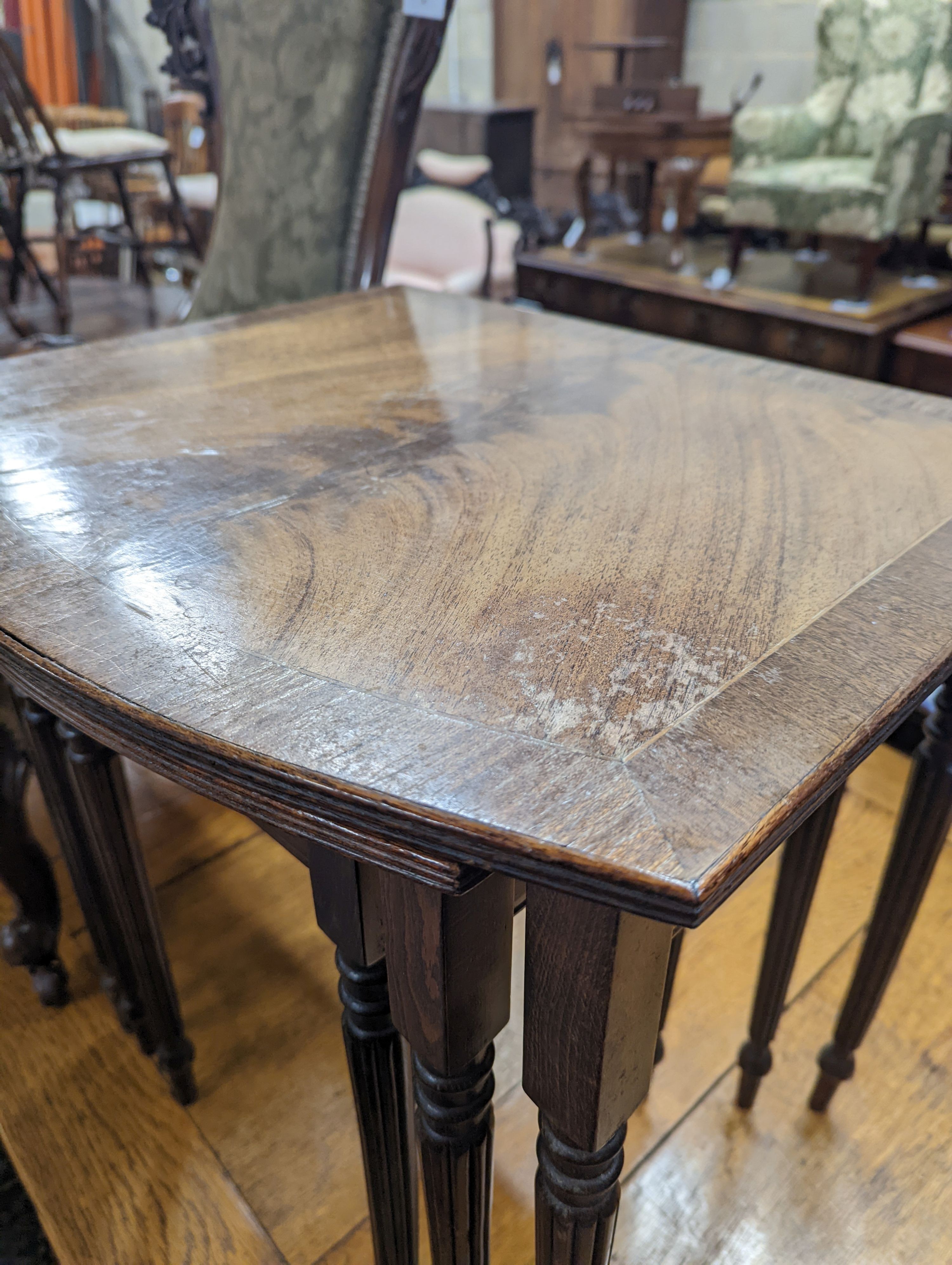 A Victorian walnut nursing chair together with a reproduction nest of tea tables